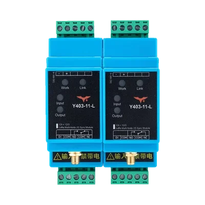 Two blue Y403-11-L multi-node wireless I/O modules with green input and relay terminals
